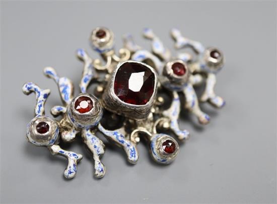 An early 20th century Austro-Hungarian? white metal, garnet and enamel set brooch, 43mm, gross 13.8 grams.